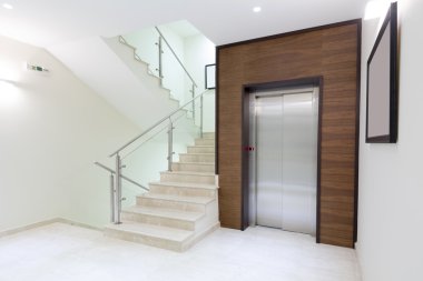 Elevator and stairs in modern building clipart