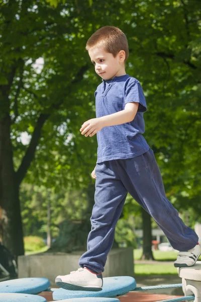 Cute boy playing in the playground — Stock Photo, Image