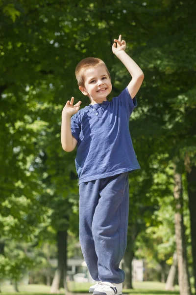 Playful boy posing outdoors — Stock Photo, Image