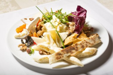 Healthy breakfast with dried fruits, cheese and bread