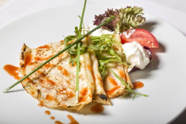 Savory crepes with tomato and cream