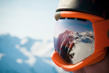 Mountain reflected in the ski mask clipart