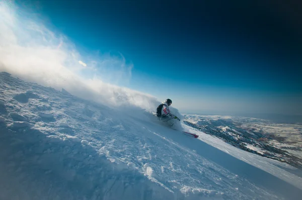 Skiing in fresh powder snow Stock Photo