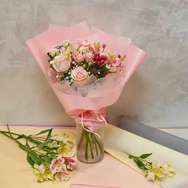 Fresh, lush bouquet of colorful mixed flowers. European floral shop concept. Flowers delivery. Beautiful fresh blossoming flowers in the florist shop fridge