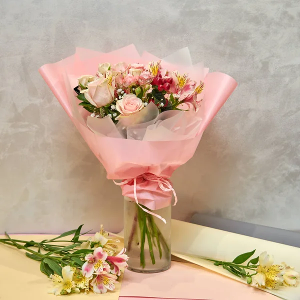 Fresh, lush bouquet of colorful mixed flowers. European floral shop concept. Flowers delivery. Beautiful fresh blossoming flowers in the florist shop fridge