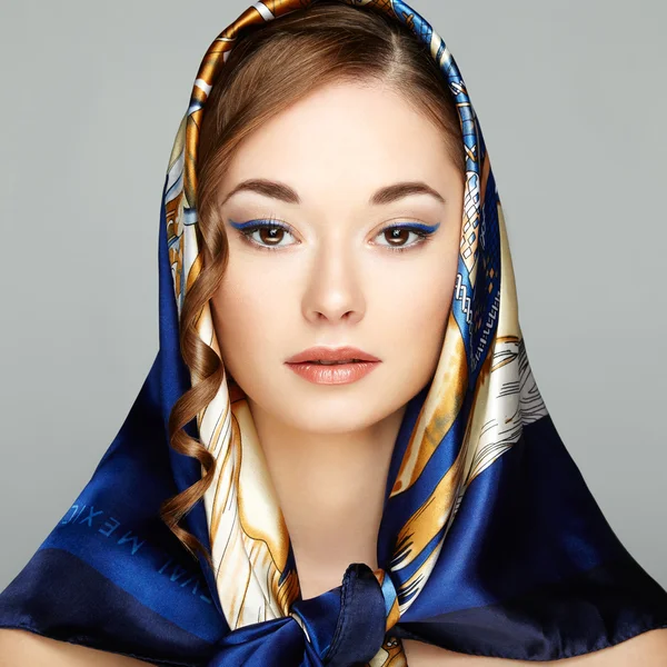 Portrait of of young beautiful woman with a scarf on head — Stock Photo, Image