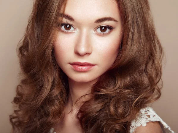 Portrait of young beautiful girl with curly hair — Stock Photo, Image