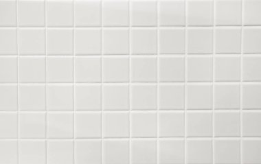 Banyo duvarında beyaz dolgu maddesi olan beyaz seramik kareler. Arkaplan.