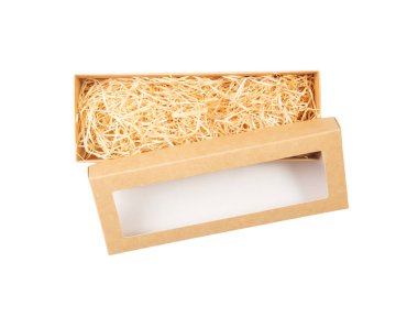 Top view of open cardboard box with shredded wood excelsior for filling inside window. Using natural sustainable material for packaging or products background. Isolated on white. clipart
