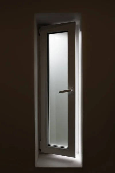 Bathroom window with frosted glass, light shining though but can not see though, privacy concept.