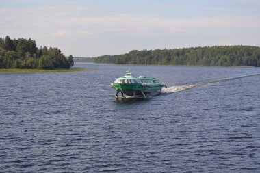 The hydrofoil Meteor follows from Petrozavodsk to the island of Kizhi, Kizhi skerries, Karelia clipart