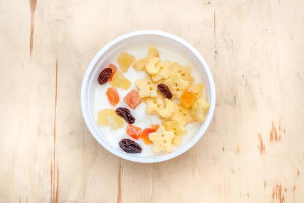 flakes and dried fruit with yogurt