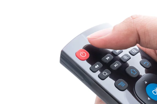 Finger will push power button on remote control over white backg — Stock Photo, Image