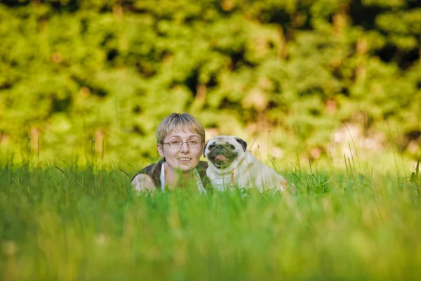 Young woman with her dog — Stock Photo, Image