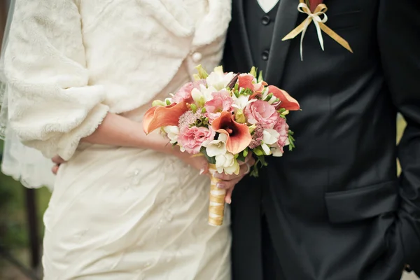 Wedding couple with brides bouquet