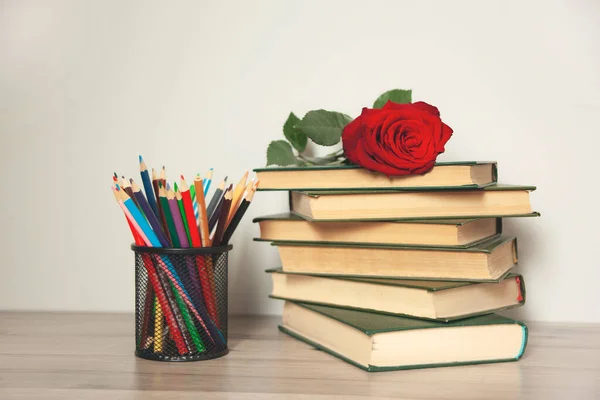 red roses on the book on  desk