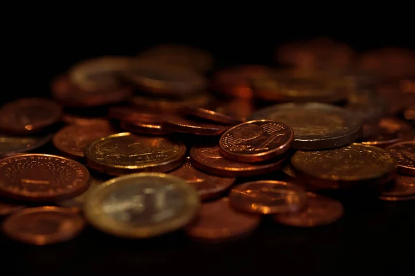 Shiny metal coins background. Wealth and finance concept. Shallow depth of field