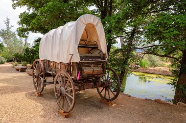 Old covered wagon from the days of the wild west clipart