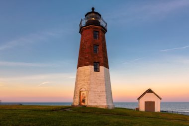 Point Judith lighthouse Famous Rhode Island Lighthouse at sunset clipart