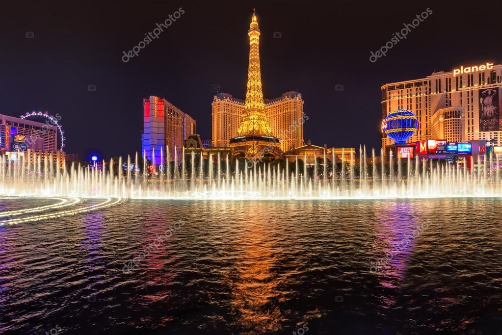 Bellagio fountain show at Paris hotel and casino on background Stock