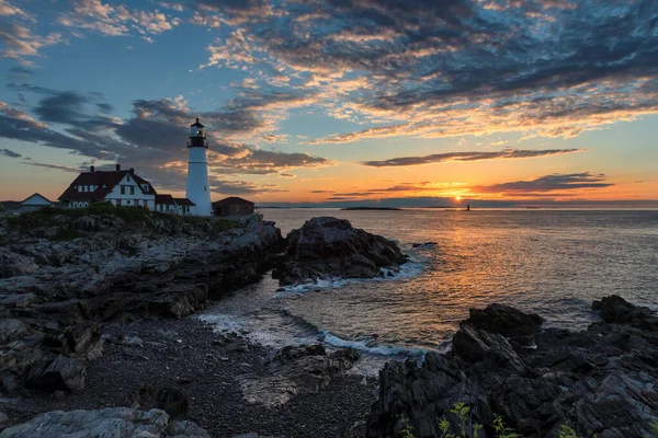 Portland Lighthouse at sunrise in Cape Elizabeth, New England, Maine, USA.  One Of The Most Iconic And Beautiful Lighthouses.