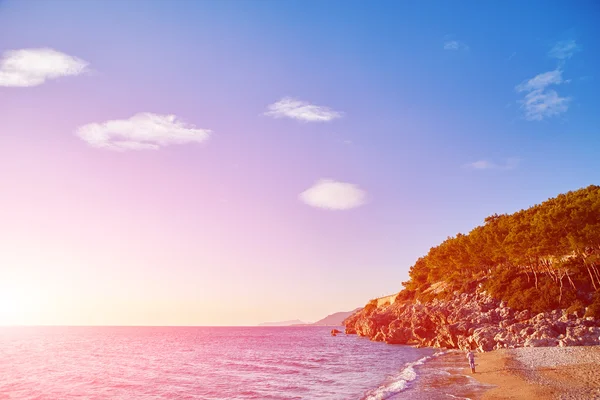 Soloppgang på stranden – stockfoto