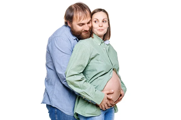 Jovem família à espera de bebê em um fundo branco — Fotografia de Stock