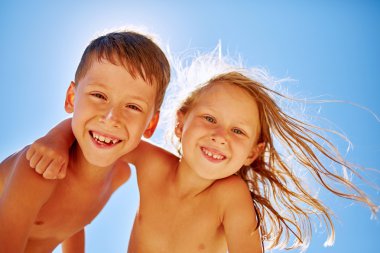 boy and girl looks into the camera 