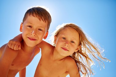 boy and girl looks into the camera 