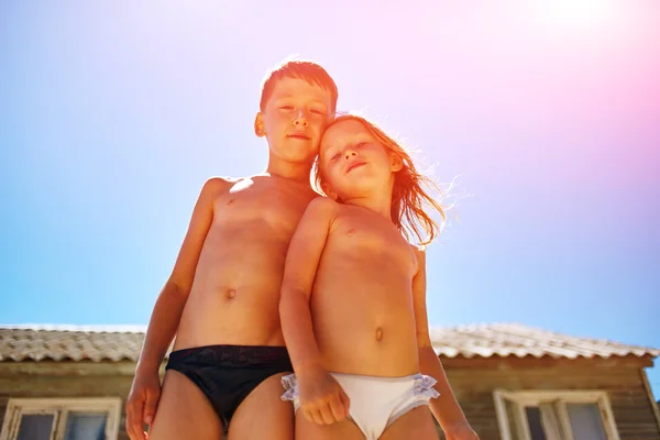 boy and girl looks into the camera 
