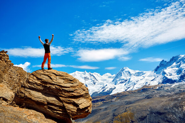hiker at the top of a pass