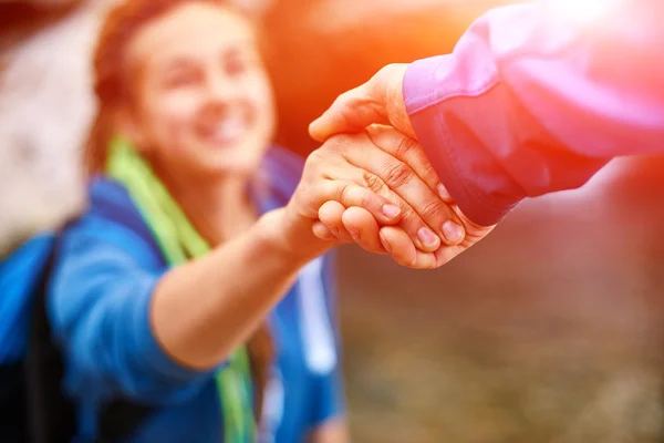 Hiker woman getting help Stock Photo