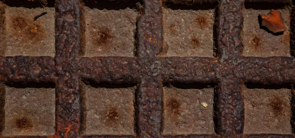 Rusty metal grilles, painted with paint and peeled off from old age, ventilation holes for air ingress in industrial facilities, an electric shield, an opening door — Stock Image Rusty Metal Grilles Painted Paint Peeled Old Age Ventilation Holes Stock Image