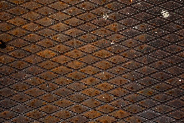 Rusty metal grilles, painted with paint and peeled off from old age, ventilation holes for air ingress in industrial facilities, an electric shield, an opening door — Stock Image Rusty Metal Grilles Painted Paint Peeled Old Age Ventilation Holes Stock Photo