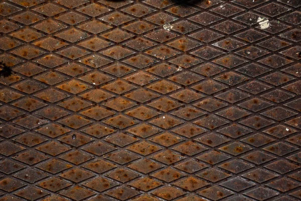 Rusty metal grilles, painted with paint and peeled off from old age, ventilation holes for air ingress in industrial facilities, an electric shield, an opening door — Stock Image Rusty Metal Grilles Painted Paint Peeled Old Age Ventilation Holes Royalty Free Stock Photos