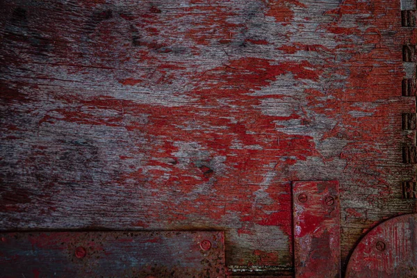 Wooden surface of the box, rusty metal parts, painted with paint and peeled off from old age, holes, nails in the base, an opening door. Screensaver background — Stock Image Wooden Surface Box Rusty Metal Parts Painted Paint Peeled Old Royalty Free Stock Photos