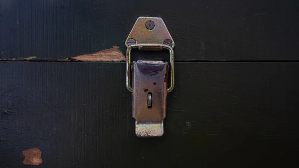 Wooden surface of the box, rusty metal parts, painted with paint and peeled off from old age, holes, nails in the base, an opening door. Screensaver background — Stock Image Wooden Surface Box Rusty Metal Parts Painted Paint Peeled Old Royalty Free Stock Images