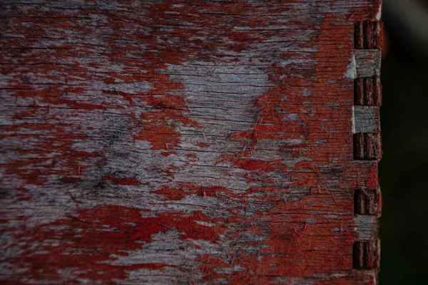 Wooden surface of the box, rusty metal parts, painted with paint and peeled off from old age, holes, nails in the base, an opening door. Screensaver background — Stock Image Wooden Surface Box Rusty Metal Parts Painted Paint Peeled Old Royalty Free Stock Images