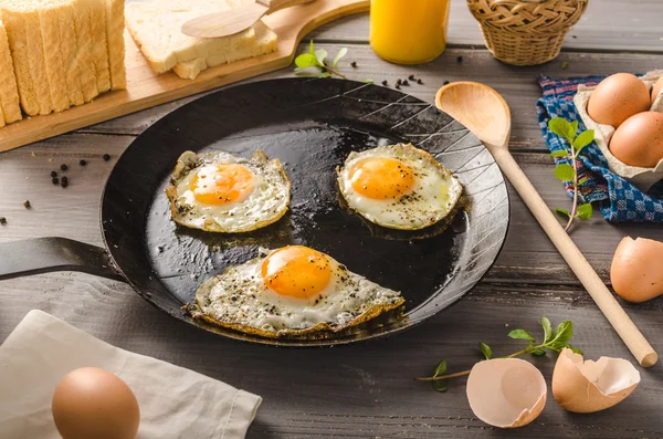 Eggs fried rustic style — Stock Photo, Image