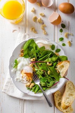 Lamb lettuce salad with fried egg clipart