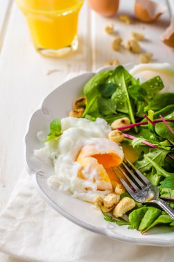 Lamb lettuce salad with fried egg clipart