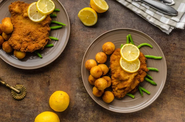 Wiener schnitzel with croquettes — Stock Photo, Image