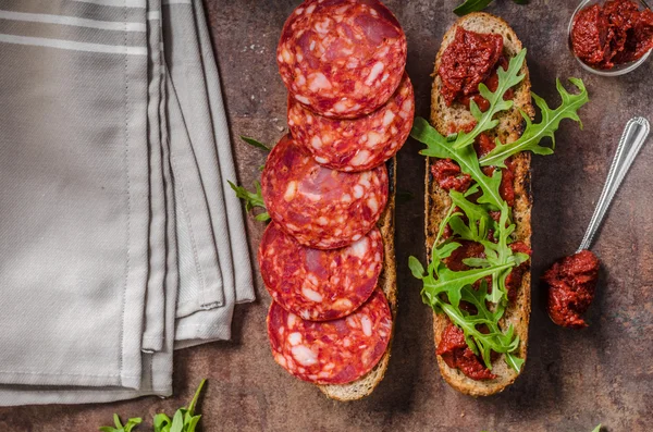 Rustic baguette with herbs and chorizo — Stock Photo, Image