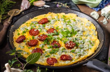Omelet with blue cheese and sausage clipart