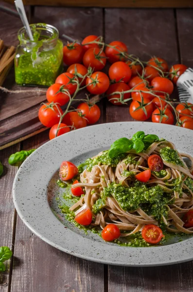 Pasta with basil pesto and parmesan — Stock Photo, Image