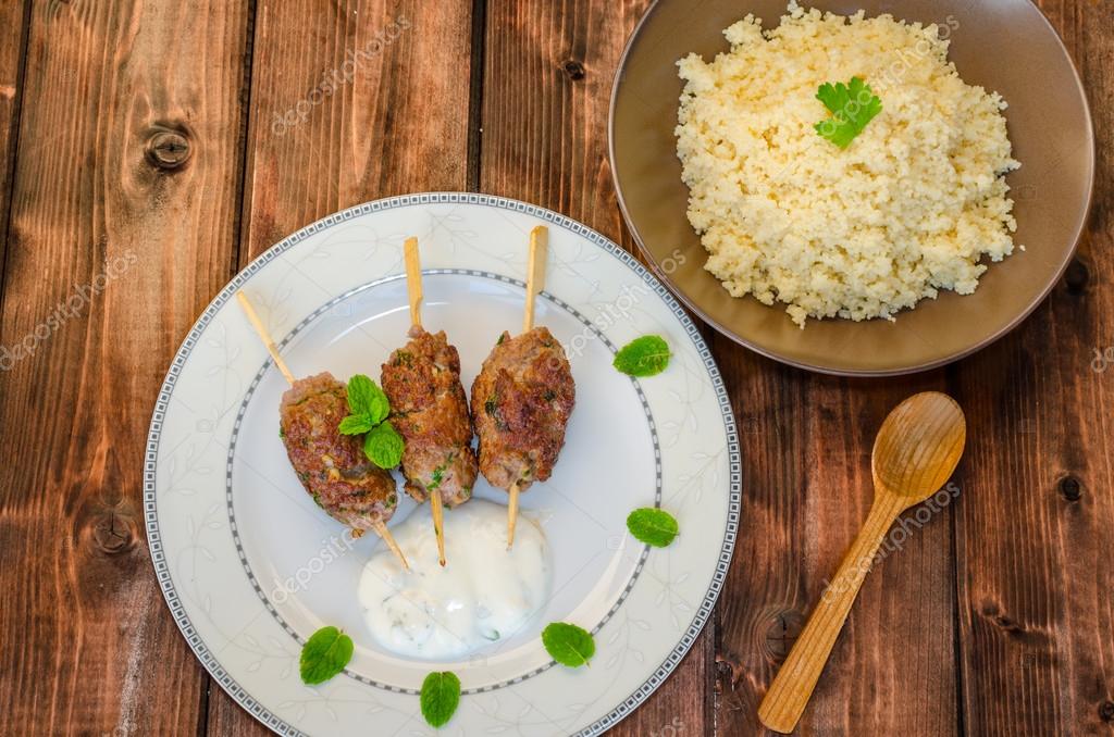 Beef kebab with with couscous — Stock Photo © Peteer 52690265