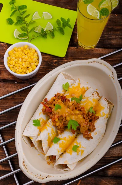 Baked meat tortilla with cheddar cheese — Stock Photo, Image