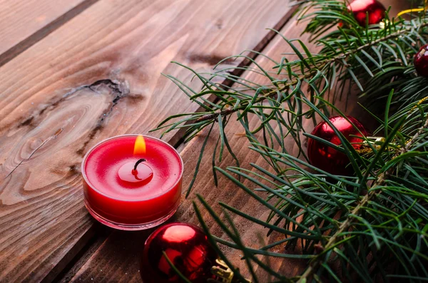 Christmas candle with pine needles — Stock Photo, Image