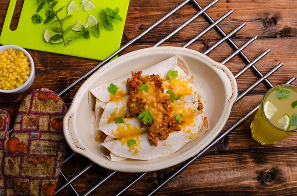 Baked meat tortilla with cheddar cheese — Stock Image Baked meat tortilla with cheddar cheese Royalty Free Stock Images