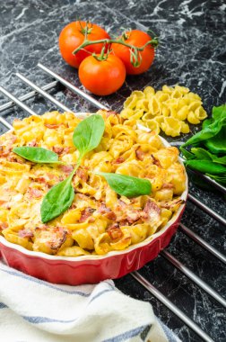 Baked homemade pasta with leeks, bacon and cream clipart